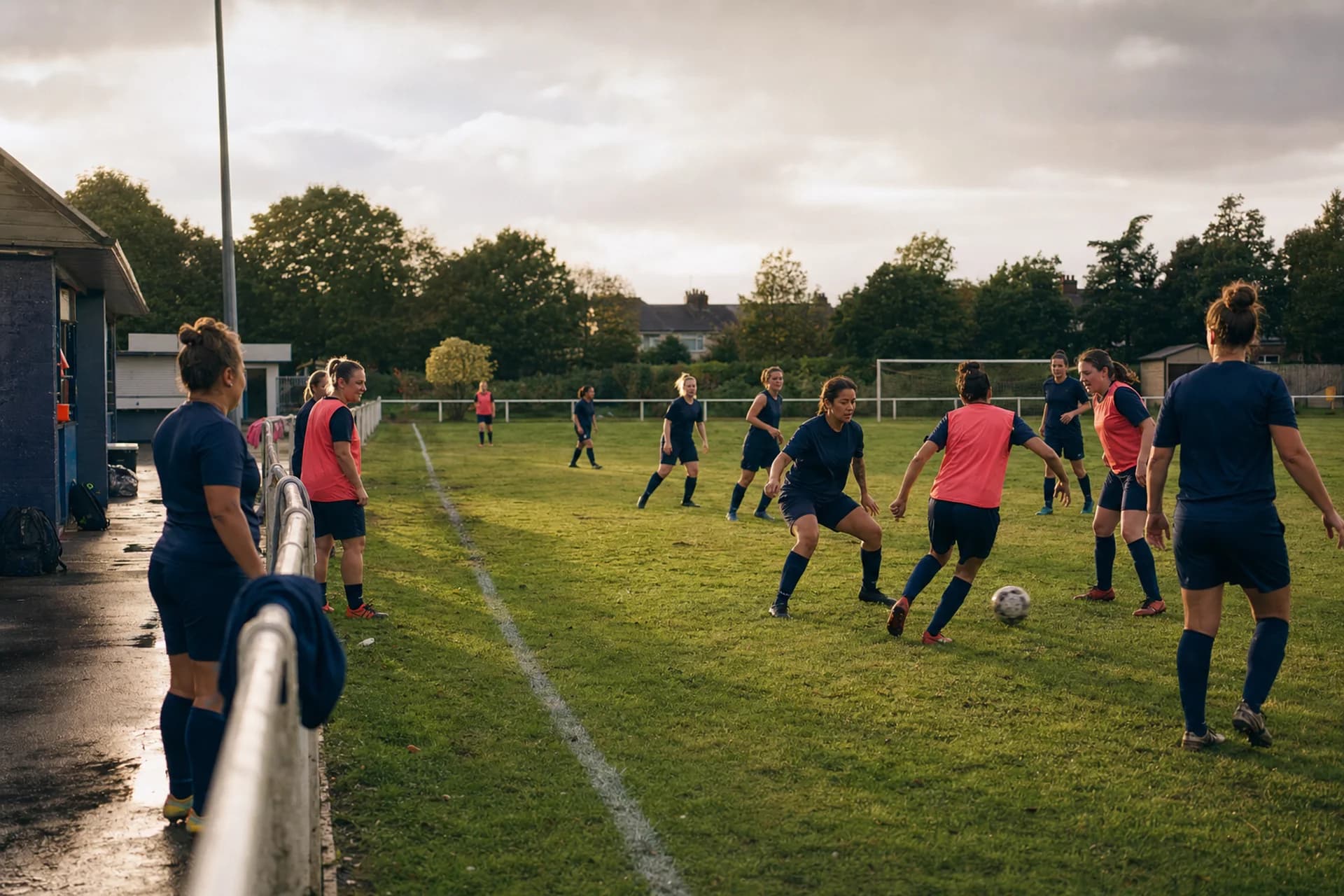 Fictional adult women taking part in a grassroots football session
